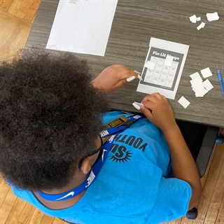 Young adult playing financial literacy game