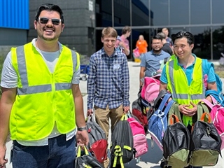 Eaton volunteers pack backpacks