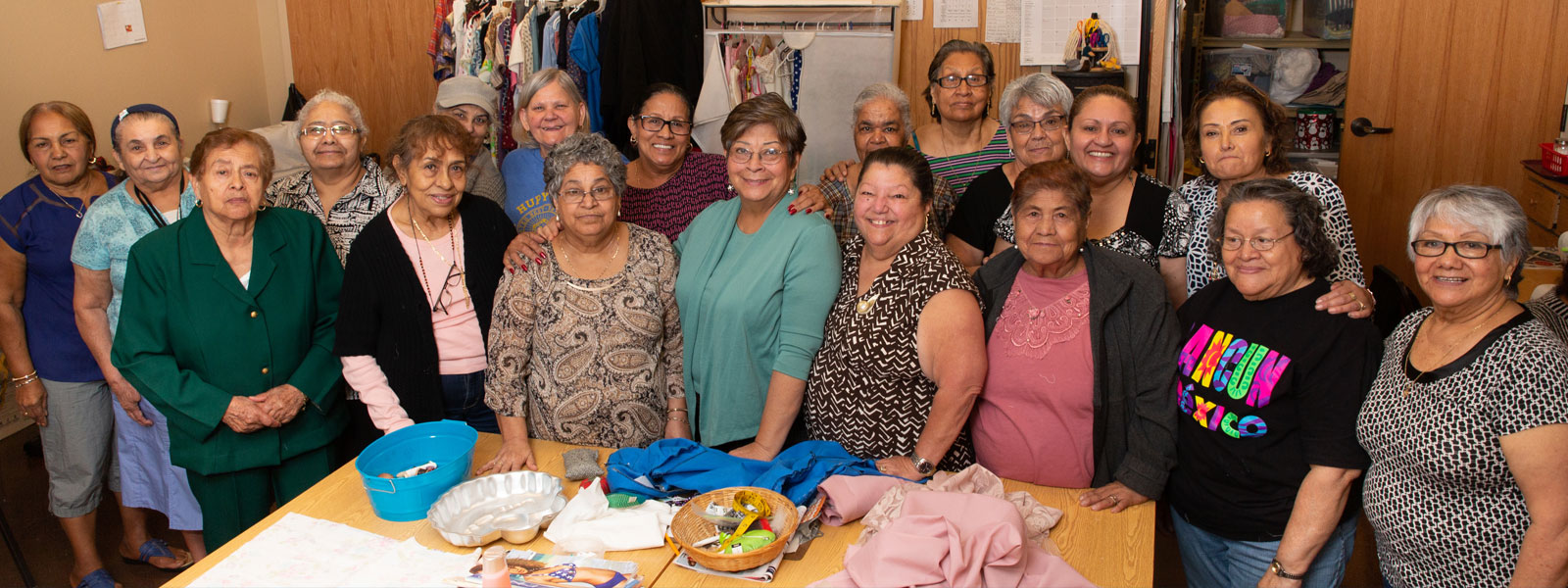 group of ladies in sewing room of community center