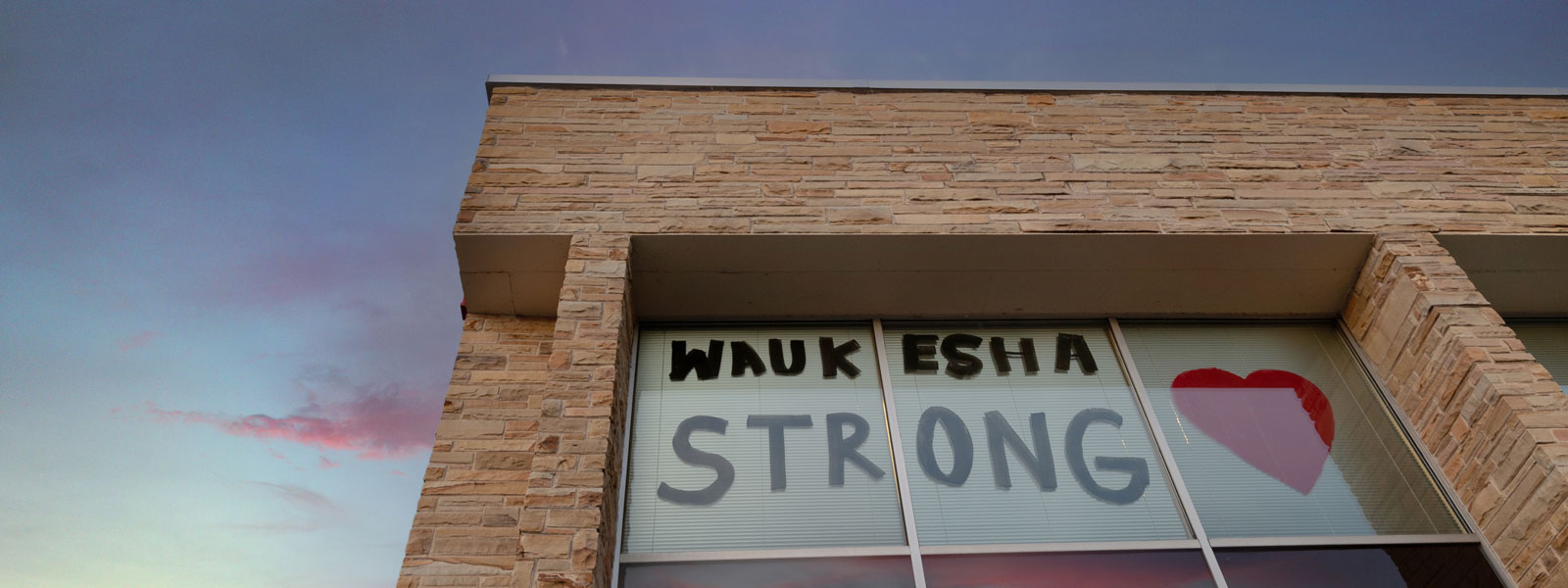 photo of building with Waukesha Strong and heart painted on the window