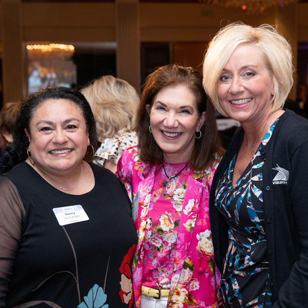 Image of three women at a professional event