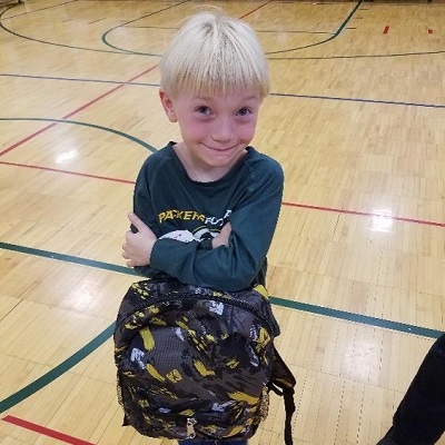 Smiling child with backpack