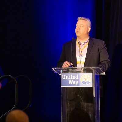 Craig Miller at a podium