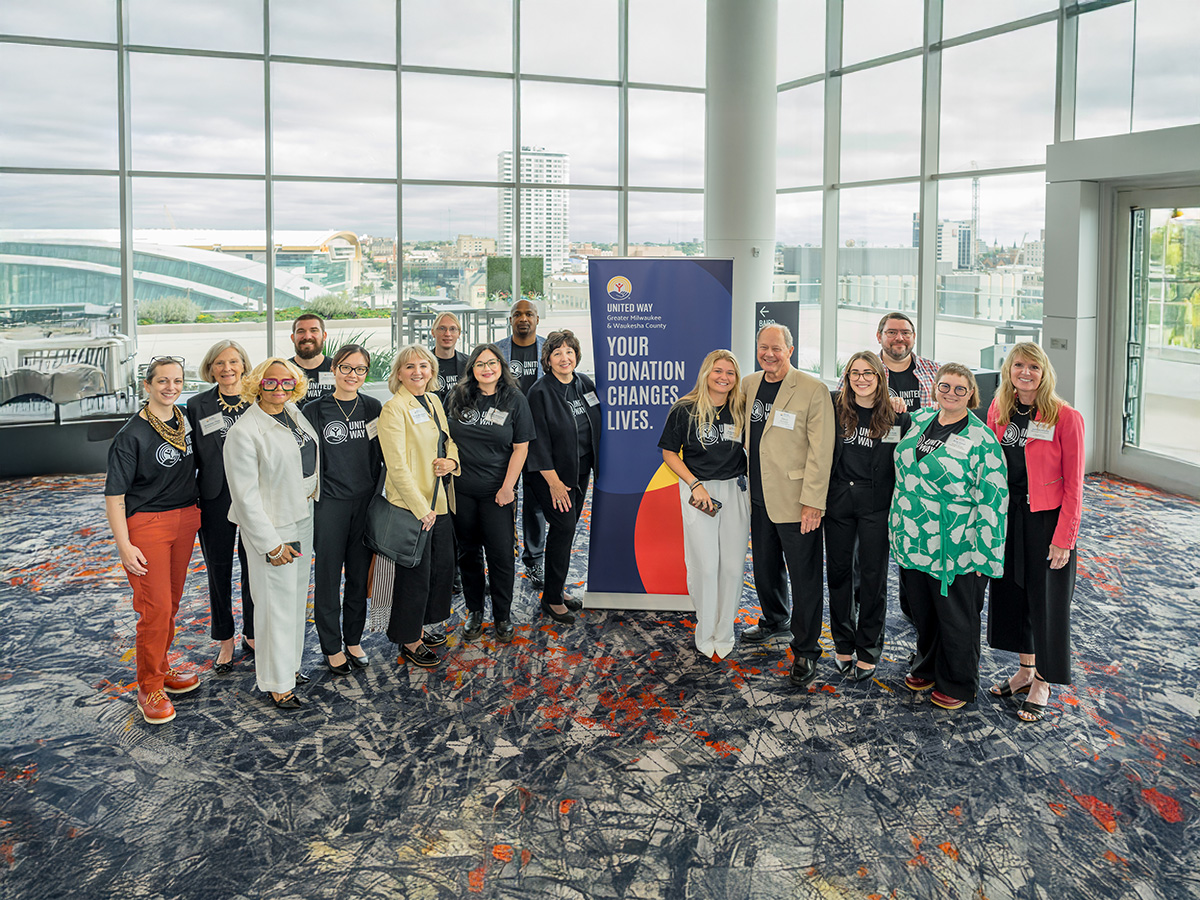 large group of professionals posing for a photo