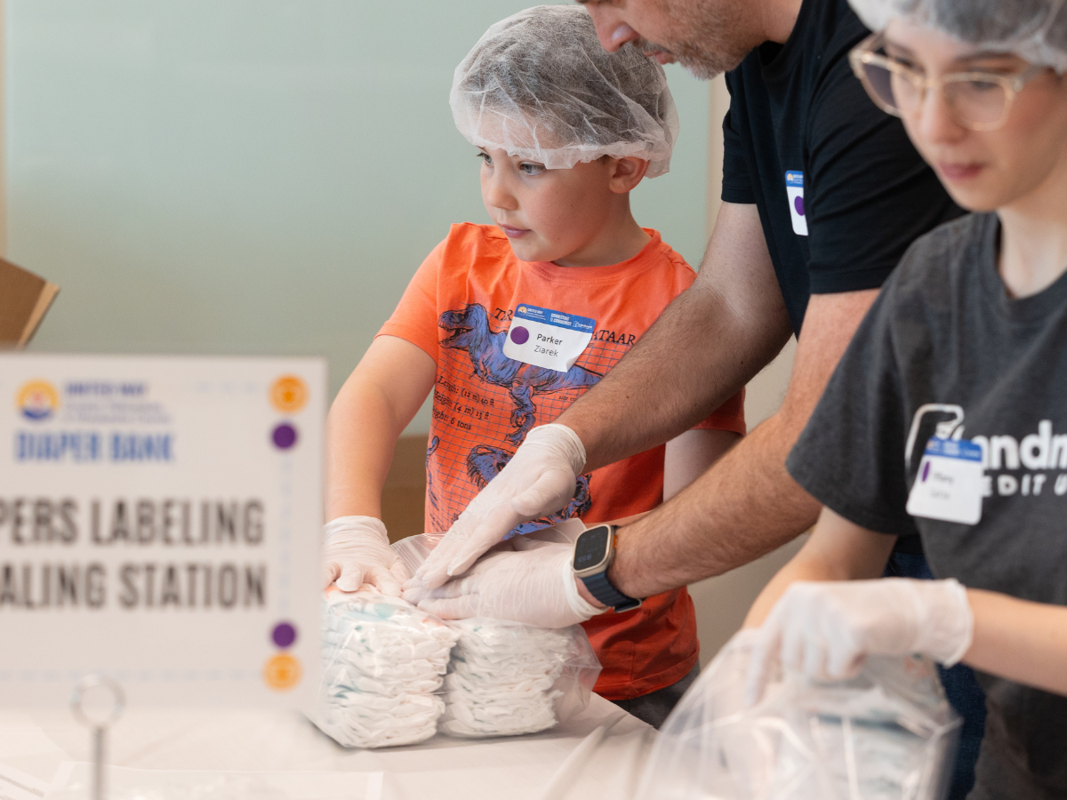 Image of family packing diapers