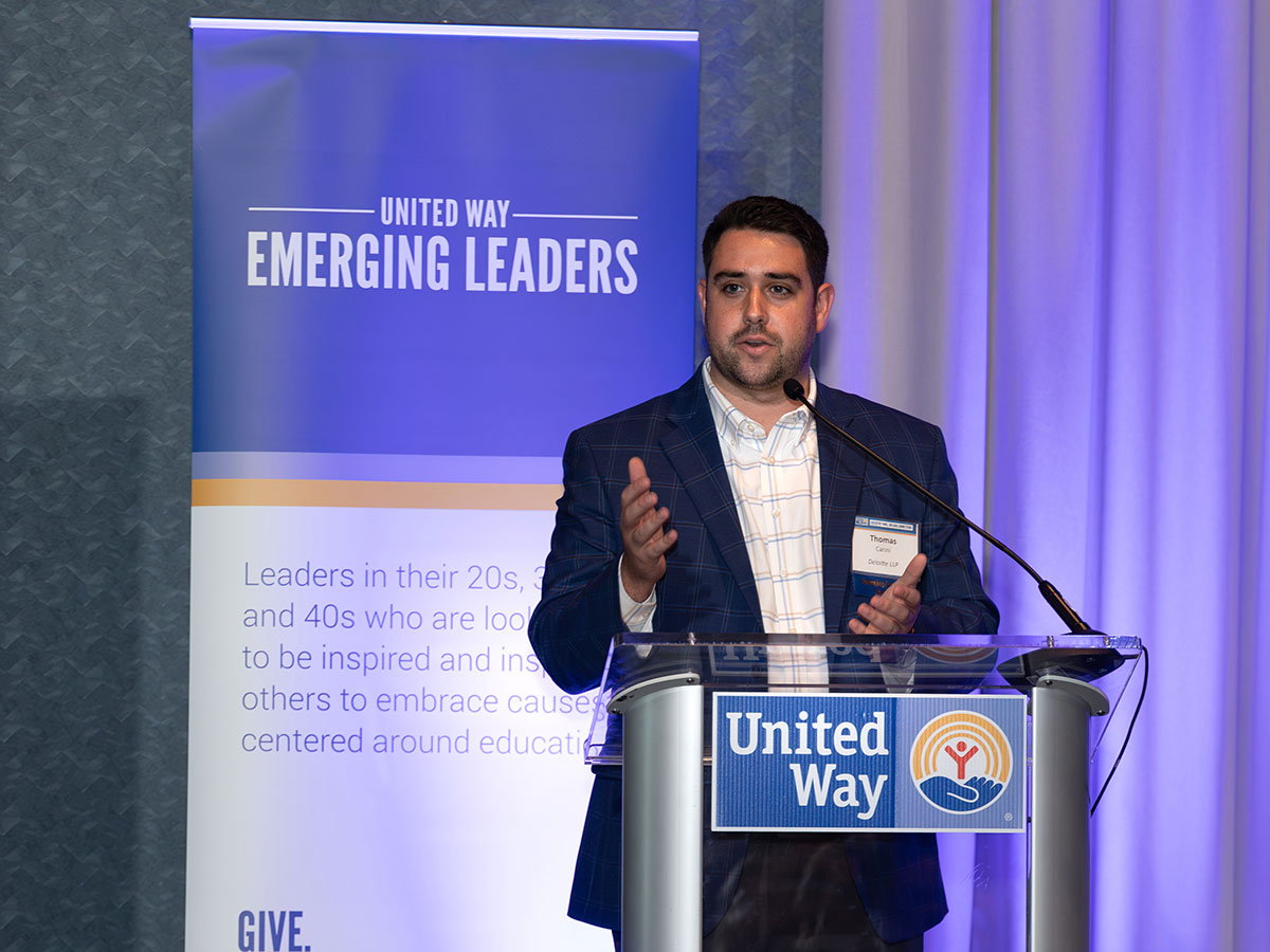 man speaking at a podium