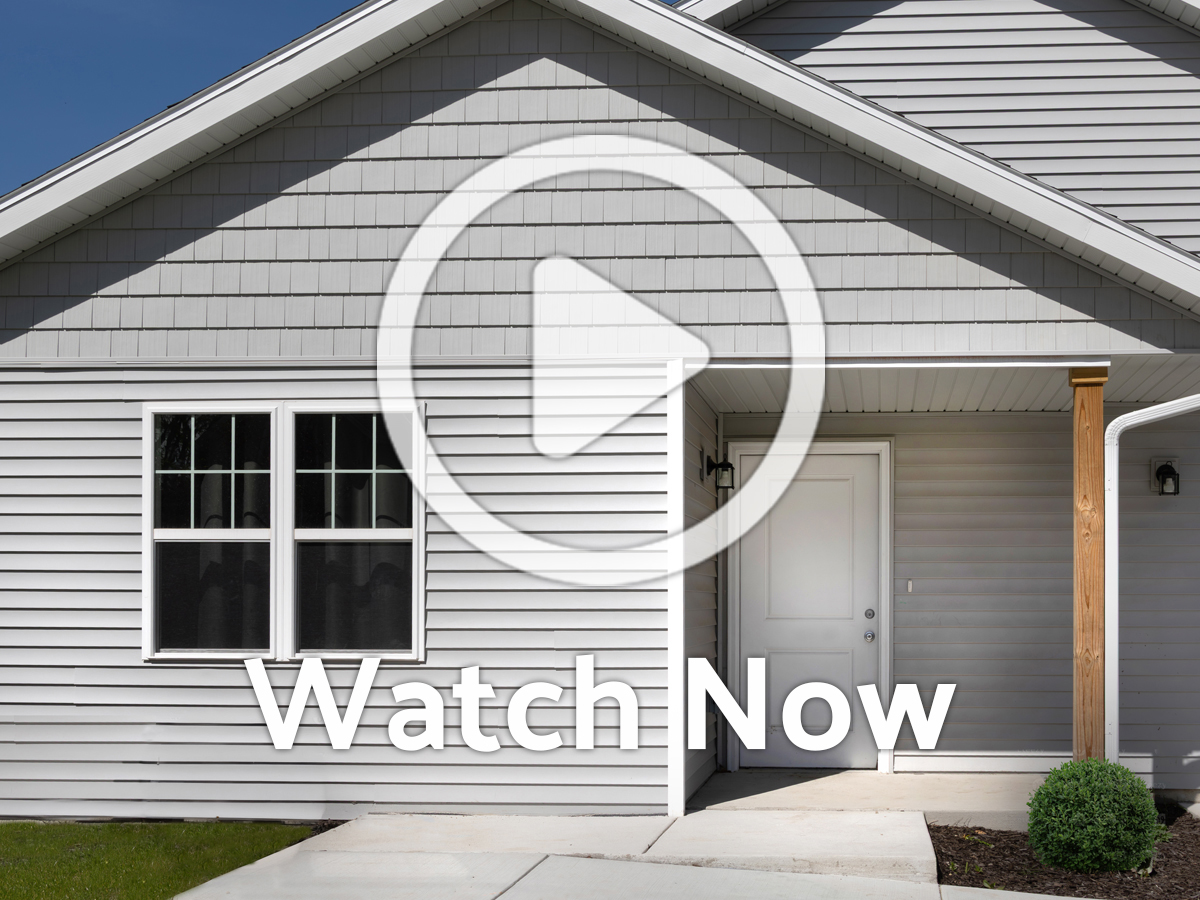 Image of a house with Overlay Play Button