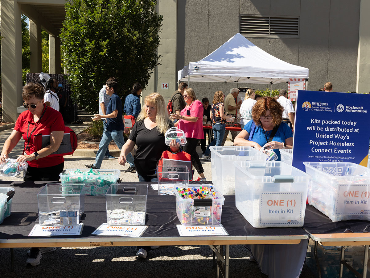 Image of volunteers packing kits at Rockwell event