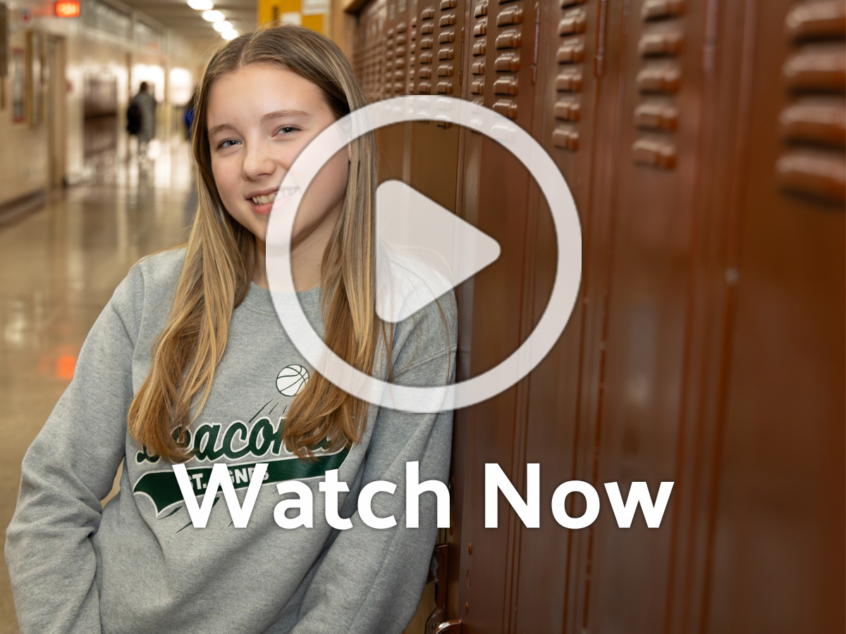Image of student in Pius Hallway with Overlay Play Button