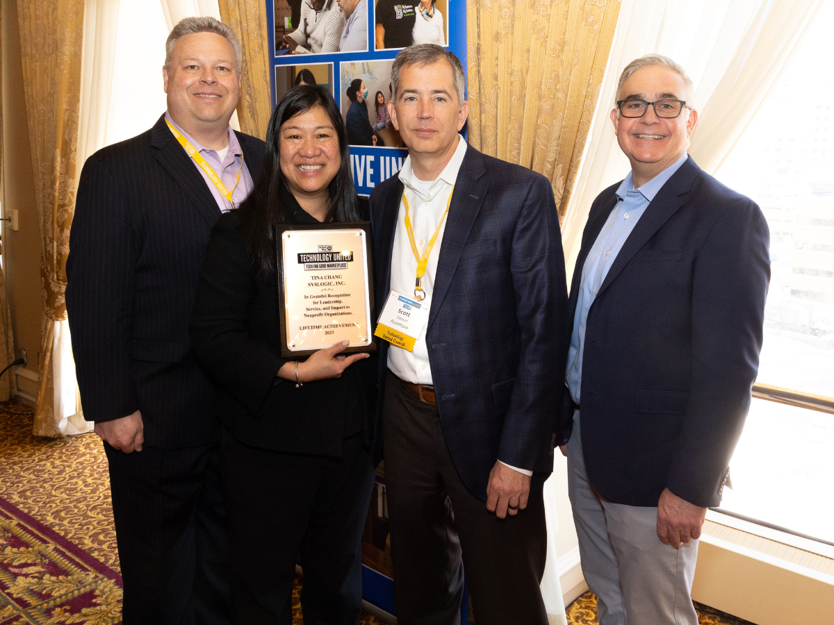 A group of people at event with award.