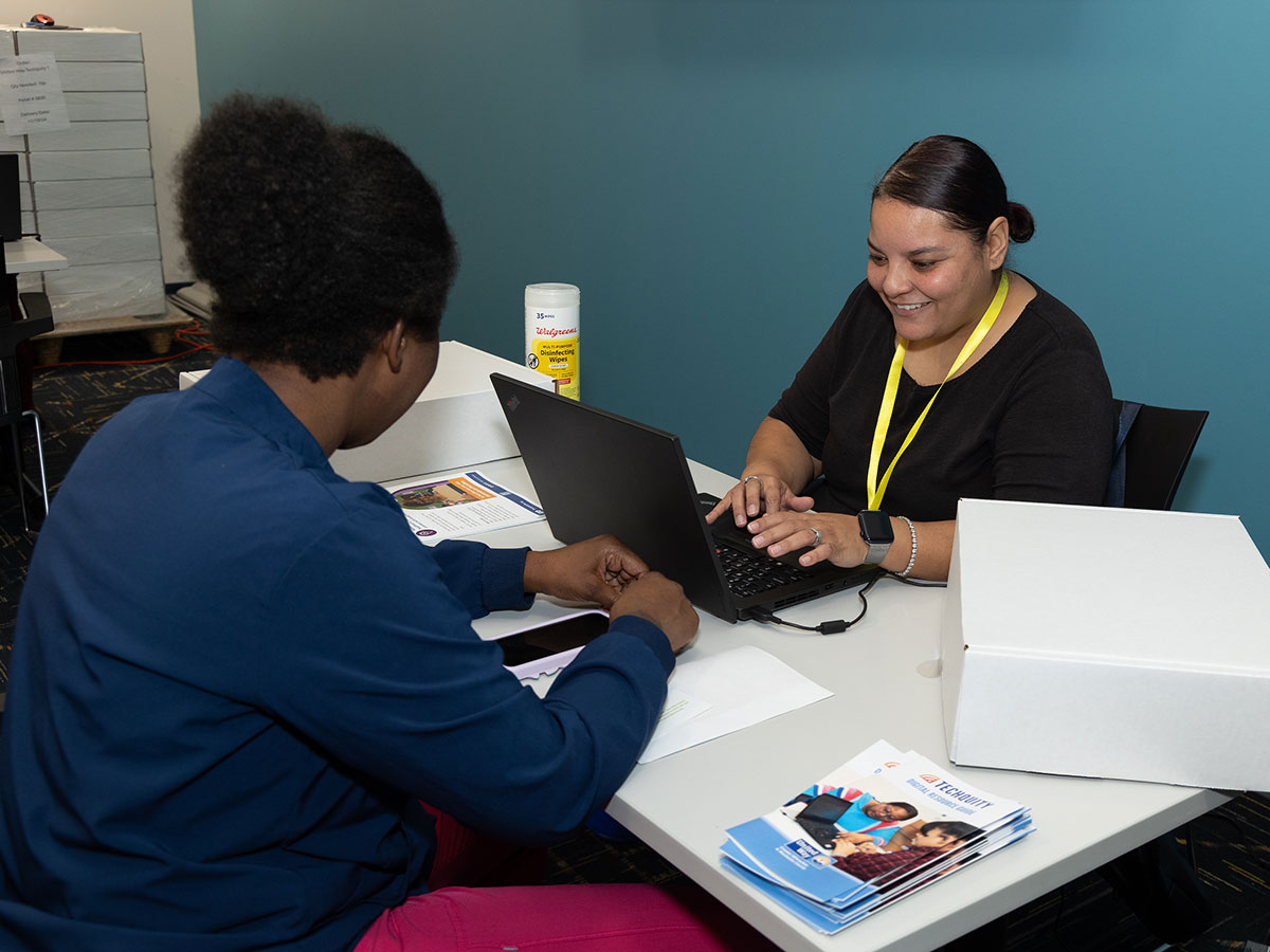 Two women working on a computer
