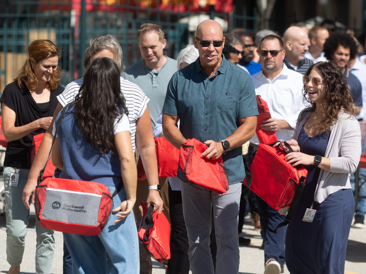 Rockwell Automation employees gather to pack supply kits.