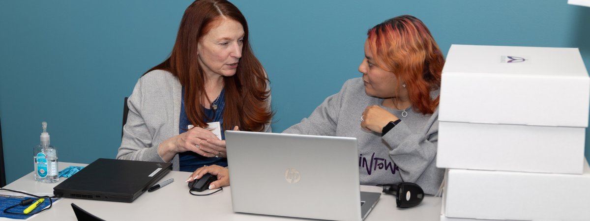 Techquity volunteers help at a Laptop Distribution Event