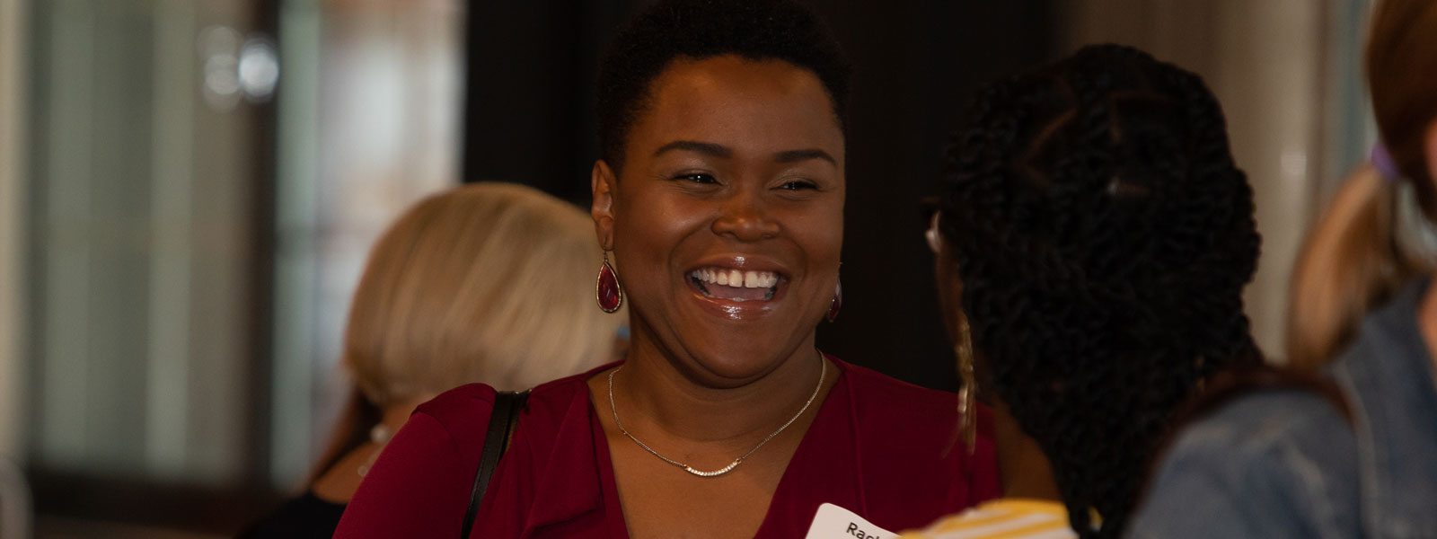 woman networking at a donor network event