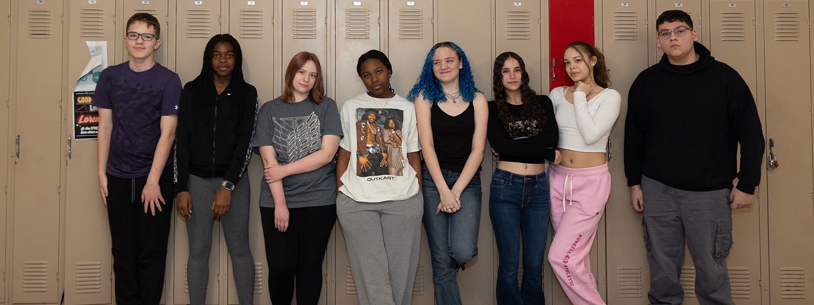 Group of high school students standing by lockers