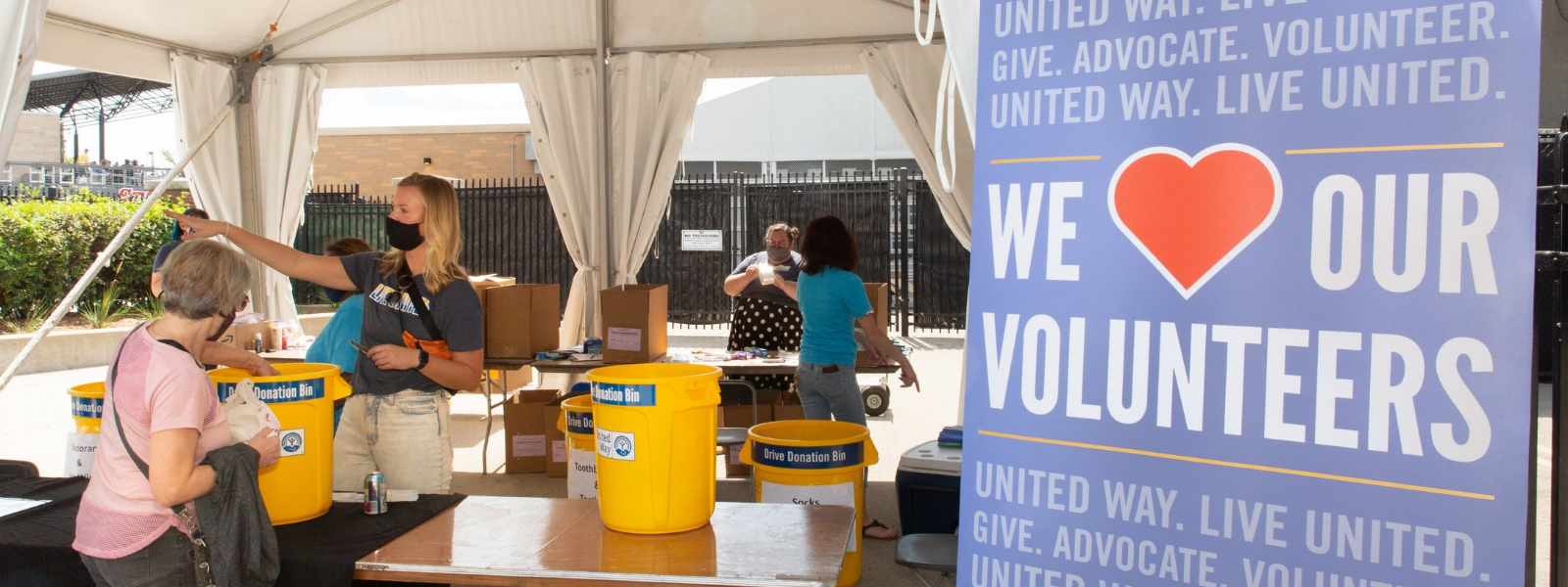 Volunteers outside loading donation bins.