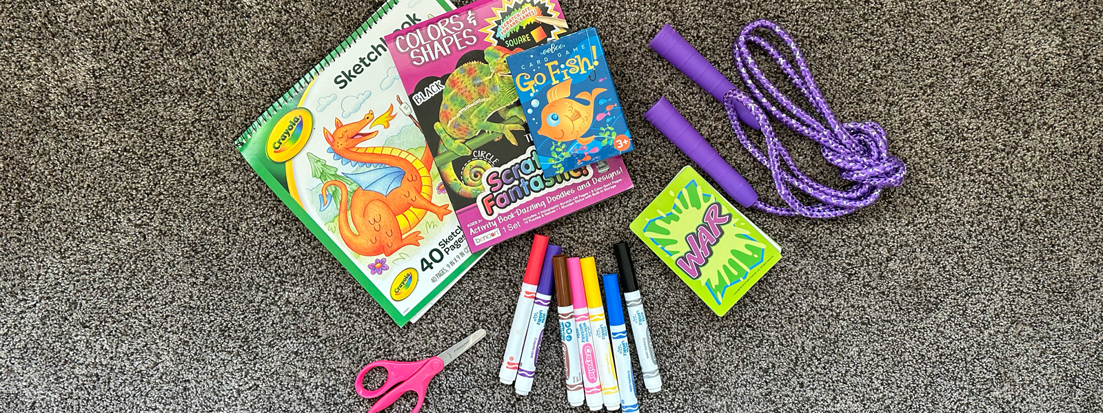 image of markers, coloring books, games, and a jump rope