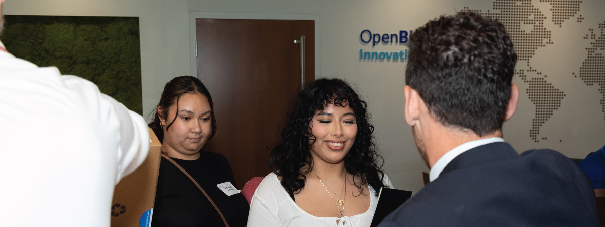 Students receive laptops at an All-In Milwaukee event
