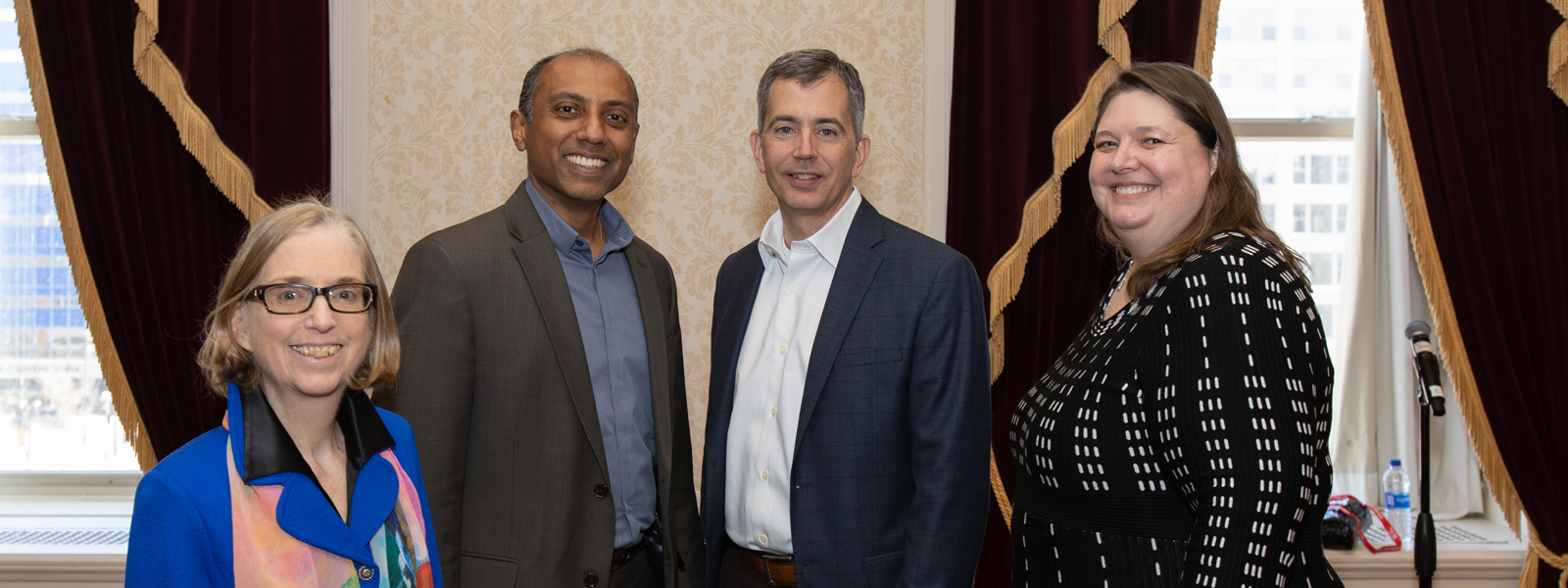 four Technology United members standing posing for a picture at the annual CIO forum