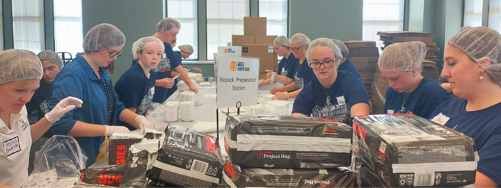 Catholic Charities and Carroll University students at a diaper repack event