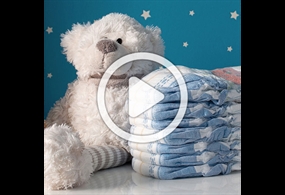 Teddy bear with diaper with overlay display button