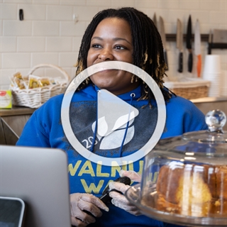Image of woman smiling at the Walnut Way counter