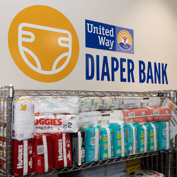 images of packages of diapers on a rolling cart