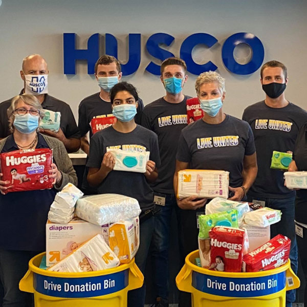group of Husco employees at a diaper collections drive during their annual fundraising campaign