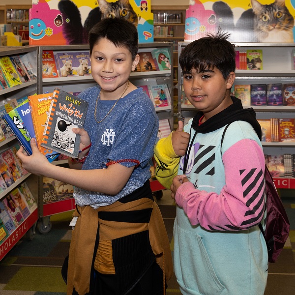 Children at Hawthorne Elementary School pick out books.