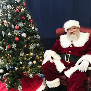image of Santa by a tree