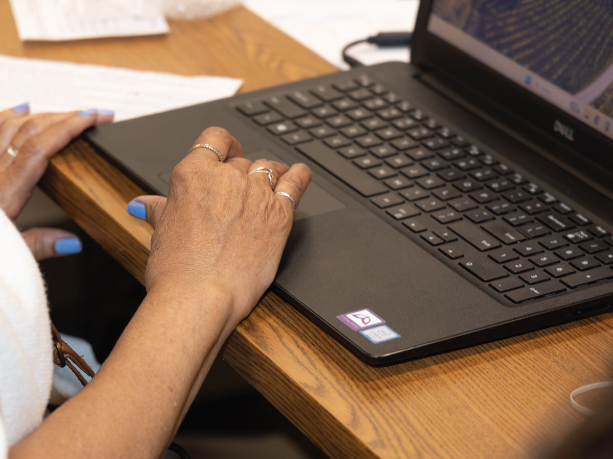 An older adult on a computer.